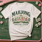 Mahjong Social Club t-shirt in Jean Blue, flat lay on white wood