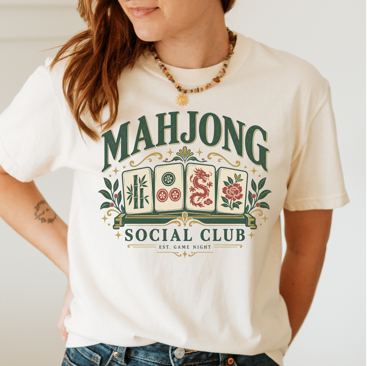 Mahjong Social Club t-shirt in Blossom, flat lay on white wood