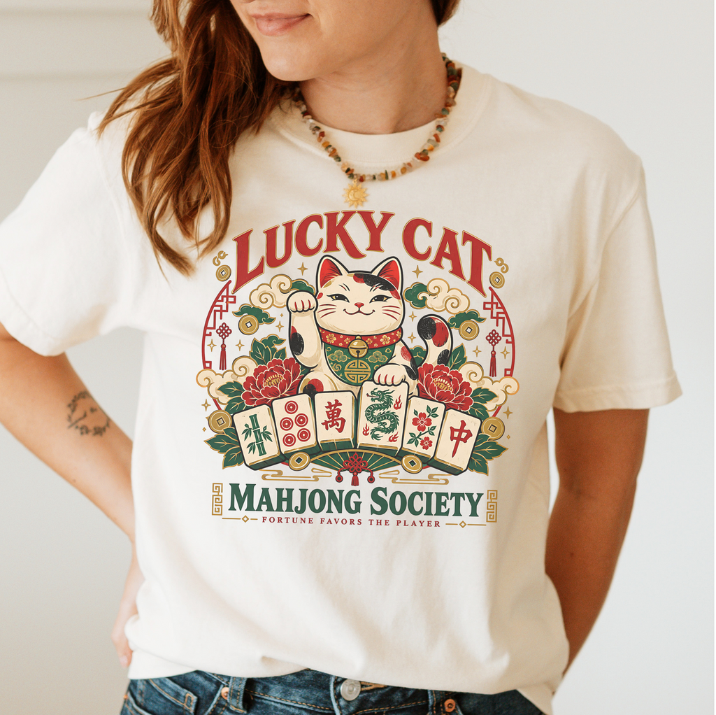 Lucky Cat Mahjong Society t-shirt in Jean Blue, flat lay on white wood