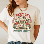Lucky Cat Mahjong Society t-shirt in Jean Blue, flat lay on white wood