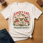 Lucky Cat Mahjong Society t-shirt in Ivory, flat lay on white wood