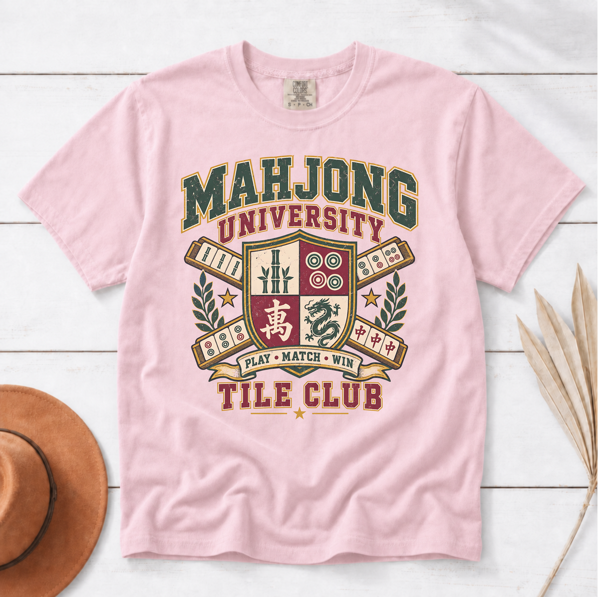 Mahjong University Tile Club t-shirt in Ivory, folded mockup on white wood