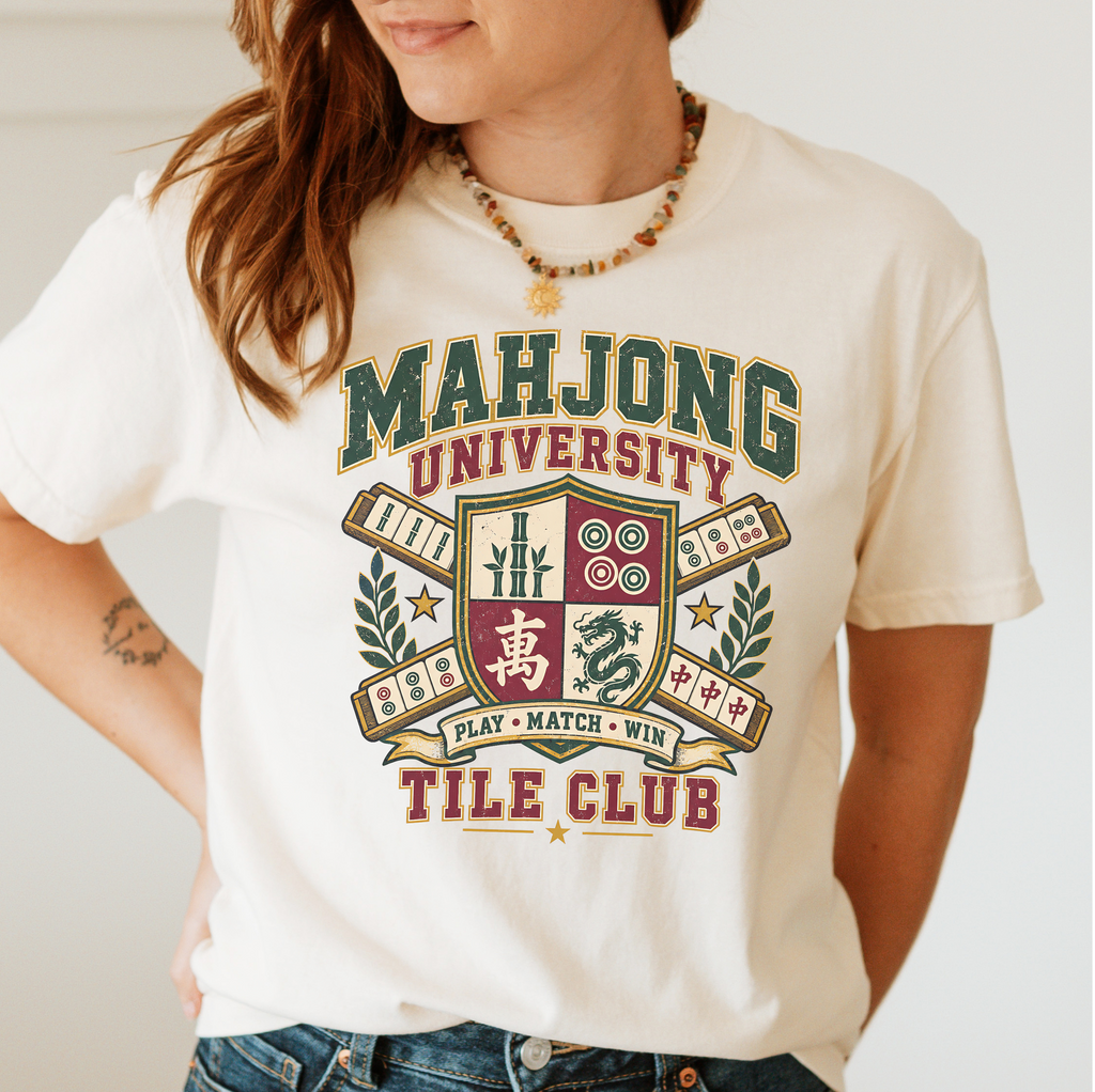Mahjong University Tile Club t-shirt in Blossom, flat lay on white wood