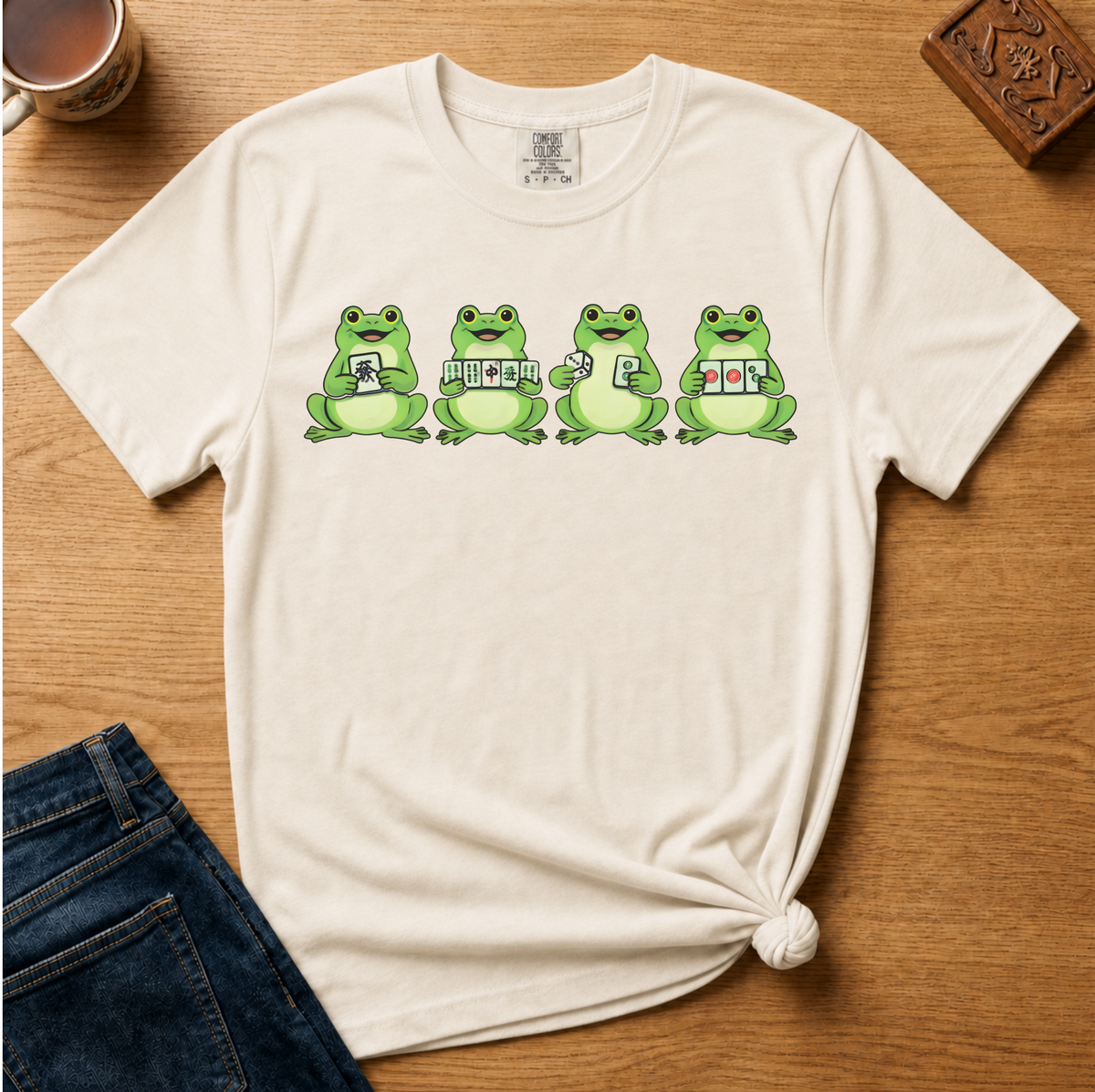 Mahjong Frogs Shirt in Moss - frogs playing mahjong design on a green Comfort Colors 1717 tee, flat lay