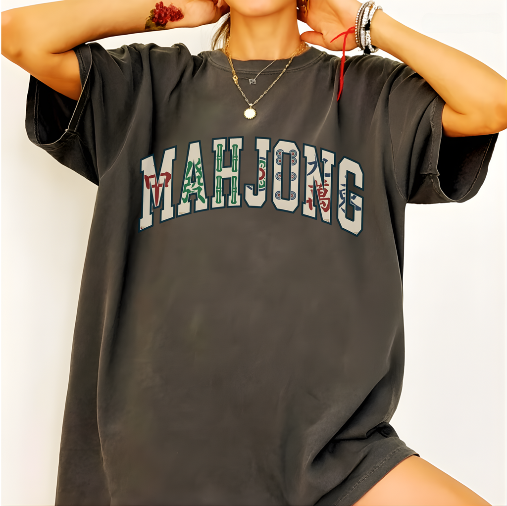 Mahjong Varsity Pattern-Filled Shirt in Moss - tile-patterned varsity MAHJONG lettering on a green Comfort Colors 1717 tee, flat lay