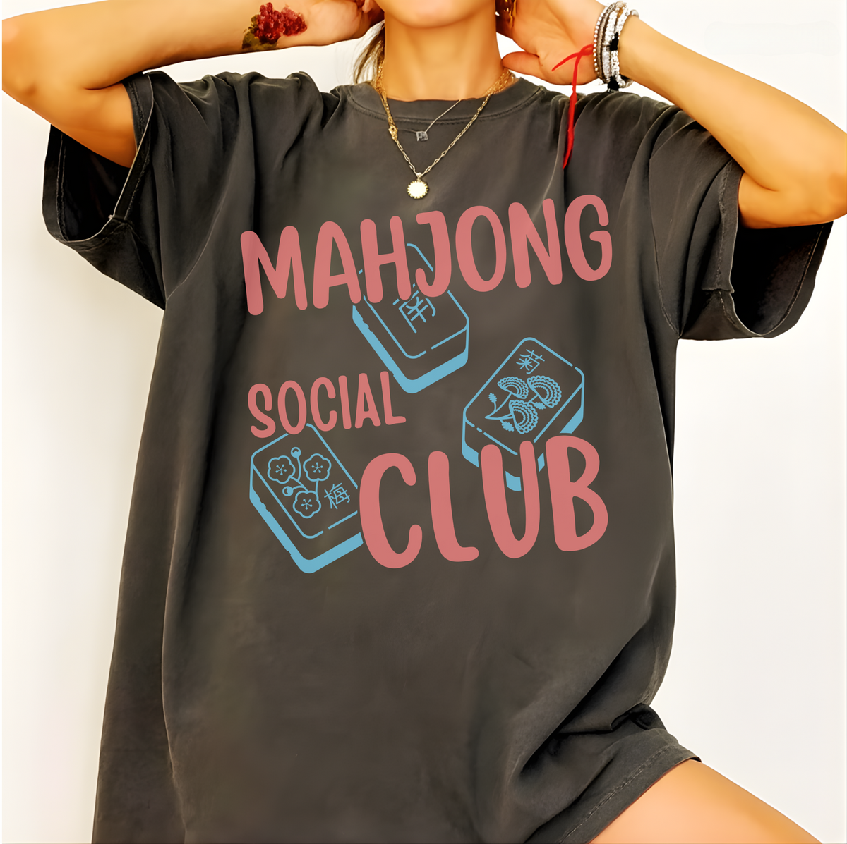 Mahjong Social Club Shirt in Pepper - MAHJONG SOCIAL CLUB typographic tile design on a dark grey Comfort Colors 1717 tee, flat lay