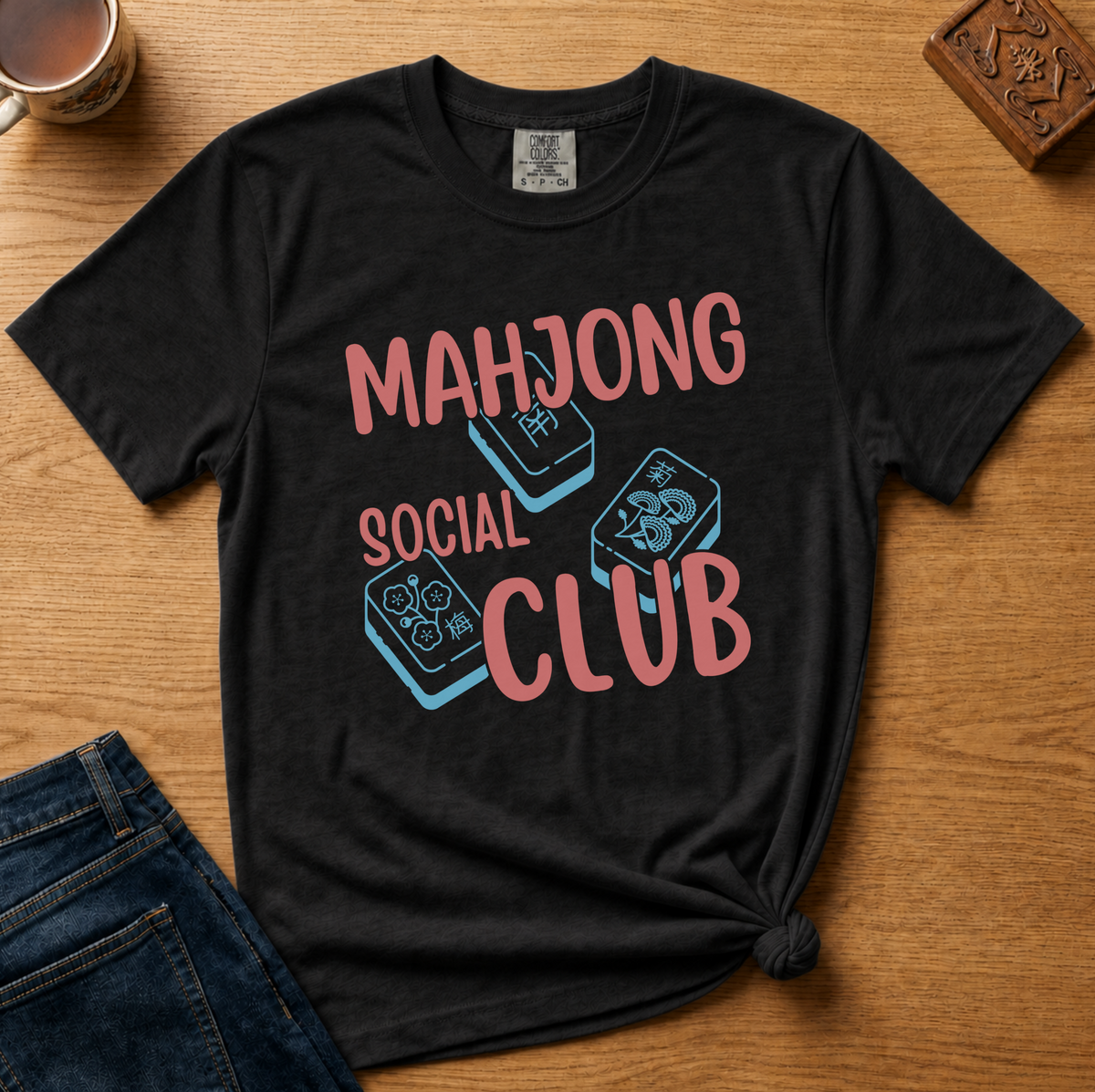 Mahjong Social Club Shirt in Berry - MAHJONG SOCIAL CLUB typographic tile design on a berry Comfort Colors 1717 tee, flat lay