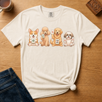 Mahjong Dogs Shirt in Pepper - four cartoon dogs holding mahjong tiles on a dark grey Comfort Colors 1717 tee, flat lay