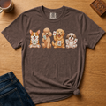 Mahjong Dogs Shirt in Black - four cartoon dogs holding mahjong tiles on a black Comfort Colors 1717 tee, flat lay