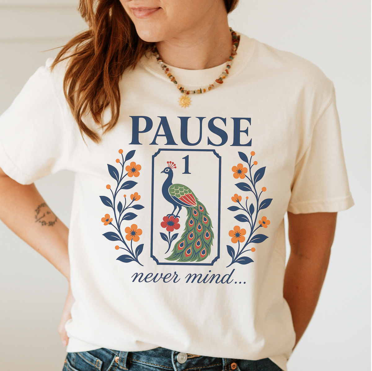 Pause Never Mind Peacock Shirt in Violet - one-bam peacock tile design on a purple Comfort Colors 1717 tee, flat lay
