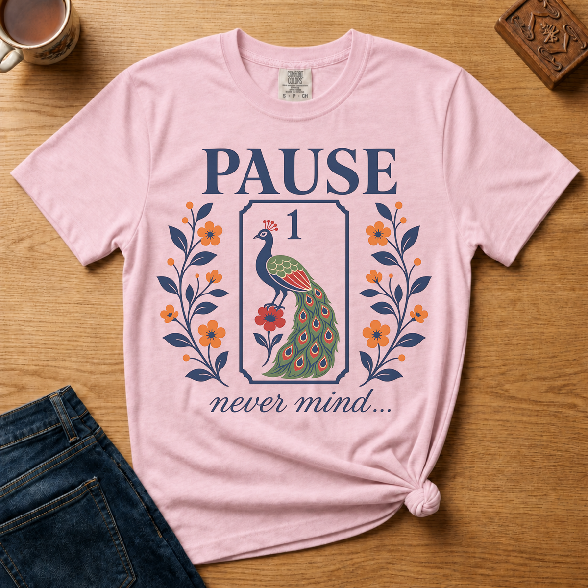 Pause Never Mind Peacock Shirt in Ivory - one-bam peacock tile design on an ivory Comfort Colors 1717 tee, flat lay