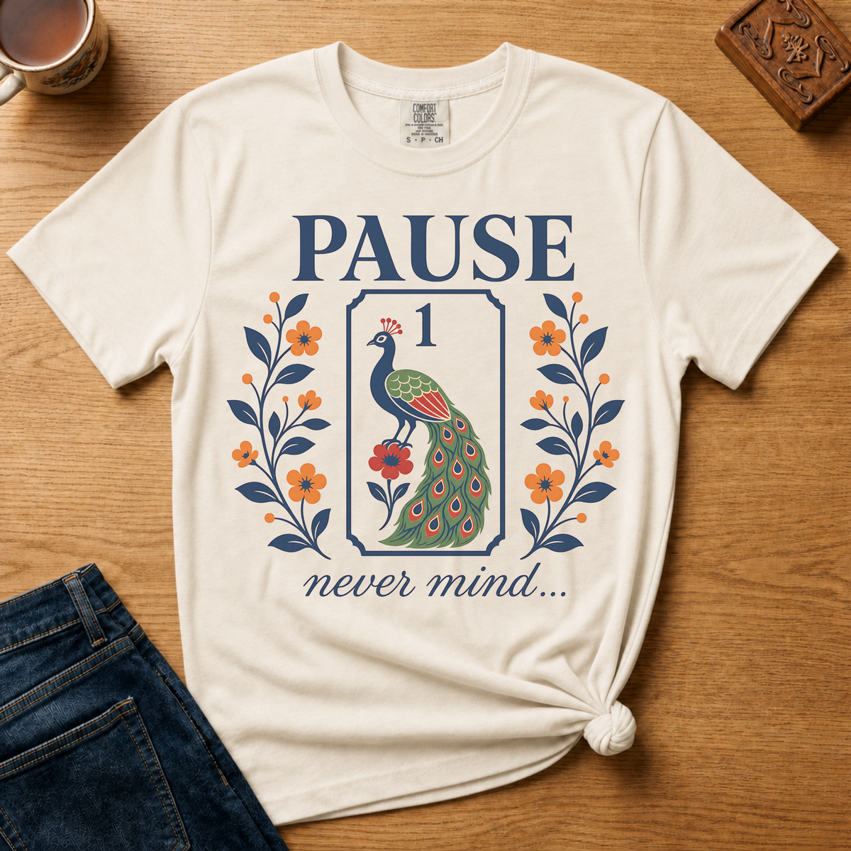 Pause Never Mind Peacock Shirt in Blossom - one-bam peacock tile design on a pink Comfort Colors 1717 tee, flat lay