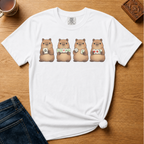 Mahjong Capybara Shirt in Blossom - four cartoon capybaras holding mahjong tiles on a pink Comfort Colors 1717 tee, flat lay