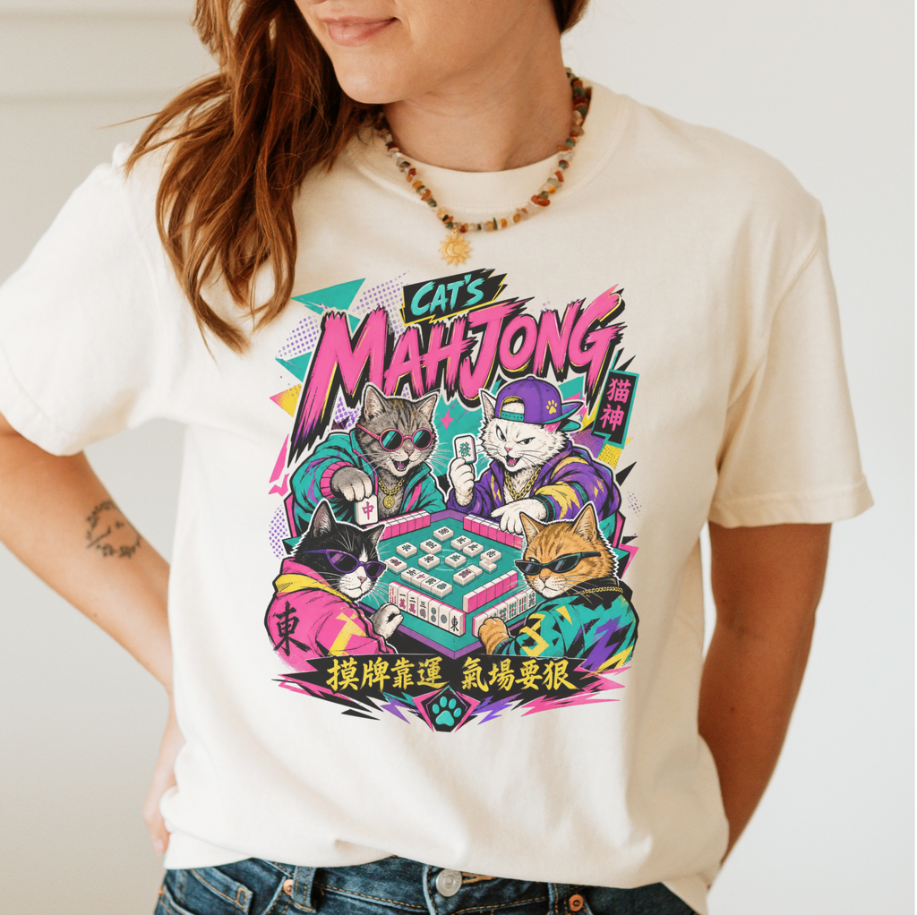 Retro 90s Mahjong Cats Shirt in Moss - four streetwear cats playing mahjong in retro anime style on a green Comfort Colors 1717 tee, flat lay