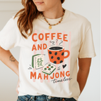 Striped Coffee and Mahjong Shirt in Ivory - orange lettering with polka-dot mug and tiles over pink stripes on an ivory Comfort Colors 1717 tee, flat lay