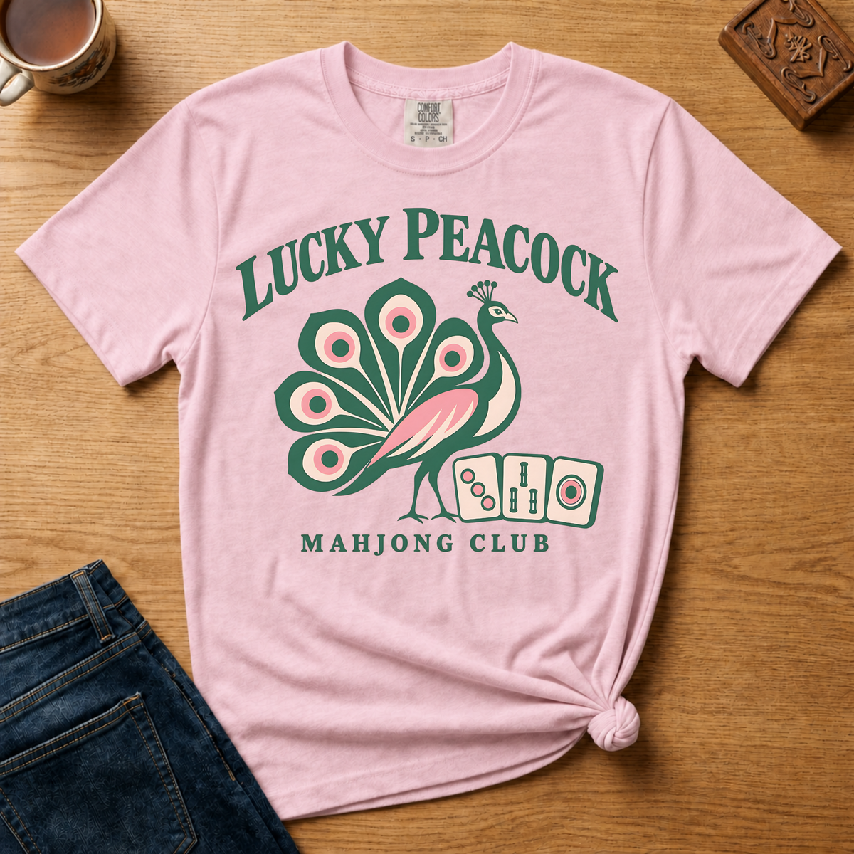 Lucky Peacock Mahjong Shirt in Ivory - green and pink peacock with mahjong tiles on an ivory Comfort Colors 1717 tee, flat lay