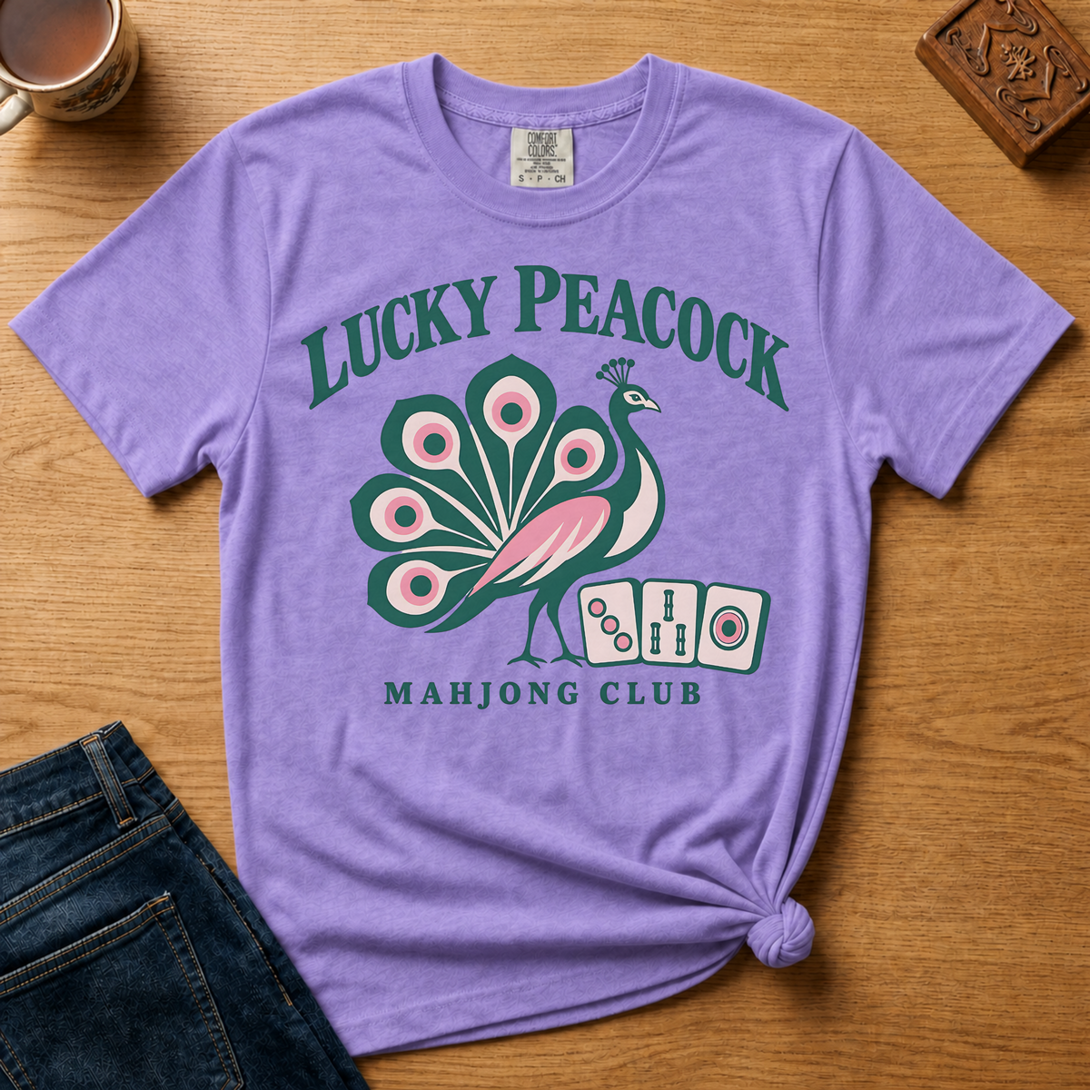 Lucky Peacock Mahjong Shirt in White - green and pink peacock with mahjong tiles on a white Comfort Colors 1717 tee, flat lay