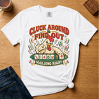Cluck Around And Find Out Shirt in Black - fierce cartoon chicken behind a mahjong tile rack on a black Comfort Colors 1717 tee, flat lay
