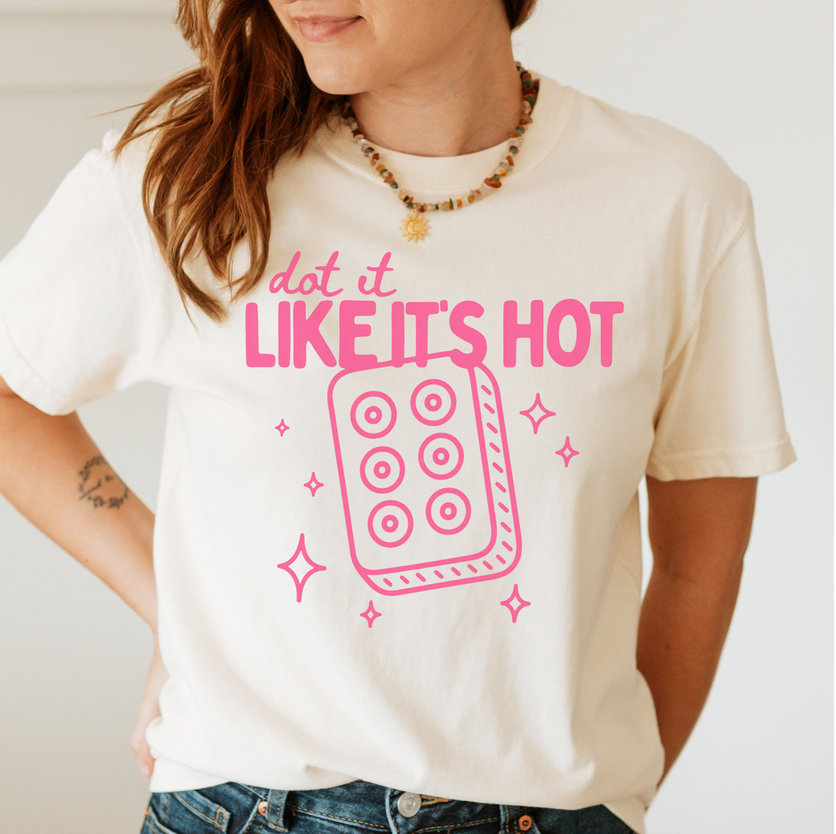 Dot It Like It's Hot Shirt in Pepper - pink dot it like it's hot lettering with a six-dot tile on a dark grey Comfort Colors 1717 tee, flat lay