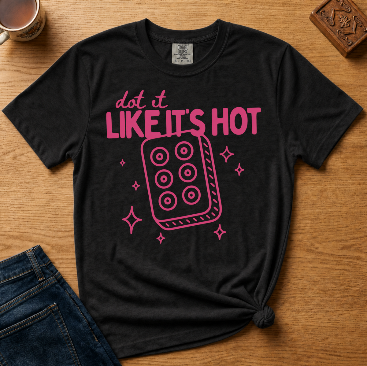 Dot It Like It's Hot Shirt in Ivory - pink dot it like it's hot lettering with a six-dot tile on an ivory Comfort Colors 1717 tee, flat lay