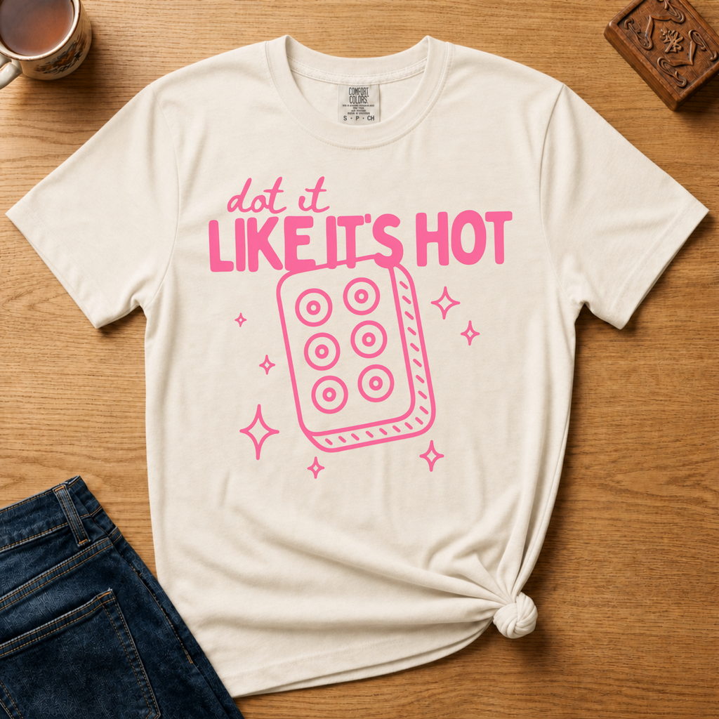 Close-up of the Dot It Like It's Hot design on white - pink lettering and six-dot tile