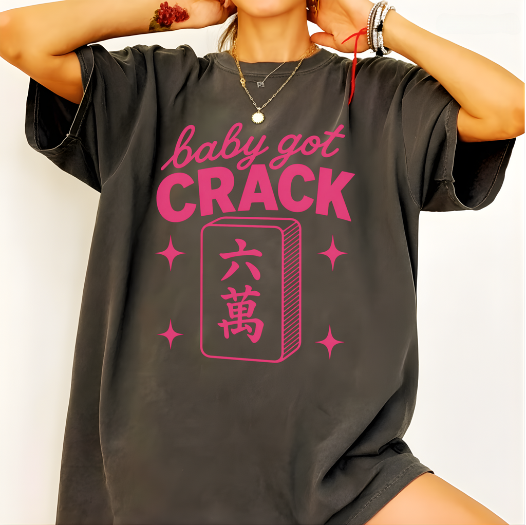 Close-up of the Baby Got Crack design on ivory - pink lettering and six-crack tile