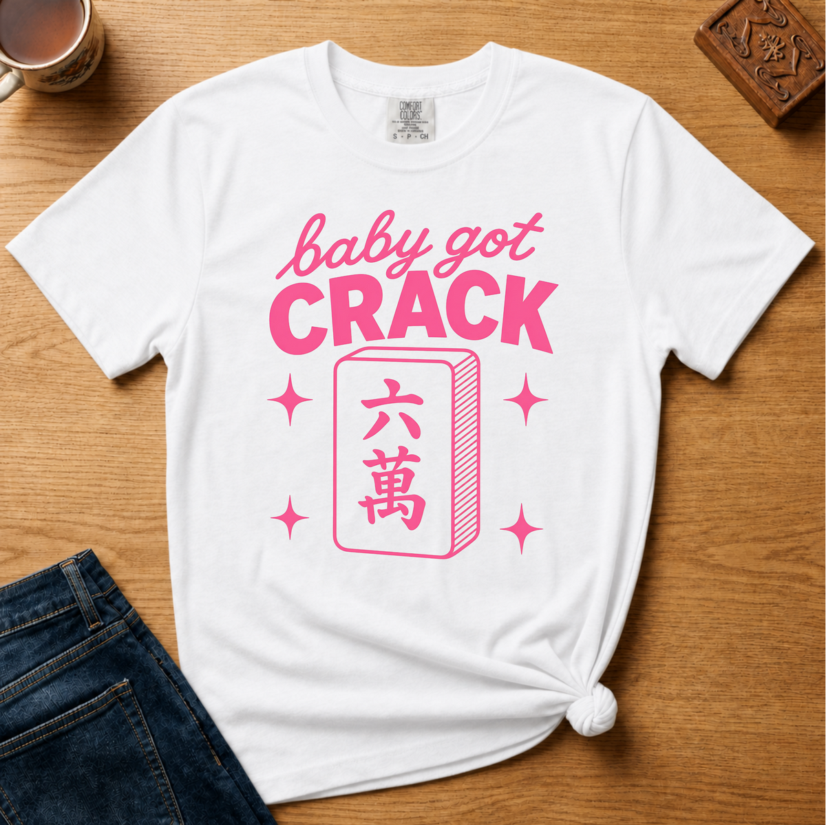 Baby Got Crack Shirt in Berry - pink baby got crack lettering with a six-crack tile on a berry Comfort Colors 1717 tee, flat lay