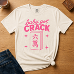 Baby Got Crack Shirt in Pepper - pink baby got crack lettering with a six-crack tile on a dark grey Comfort Colors 1717 tee, flat lay