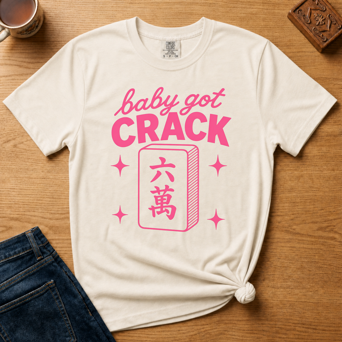 Baby Got Crack Shirt in Pepper - pink baby got crack lettering with a six-crack tile on a dark grey Comfort Colors 1717 tee, flat lay