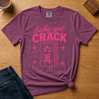 Baby Got Crack Shirt in Ivory - pink baby got crack lettering with a six-crack tile on an ivory Comfort Colors 1717 tee, flat lay