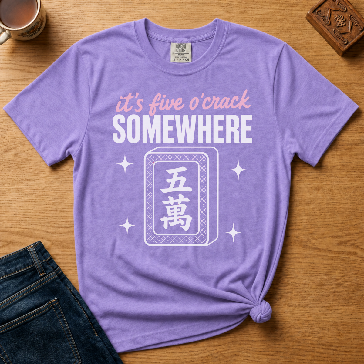 It's Five O'Crack Somewhere Shirt in Jean Blue - pink and white five o'crack lettering with a five-crack tile on a slate blue Comfort Colors 1717 tee, flat lay