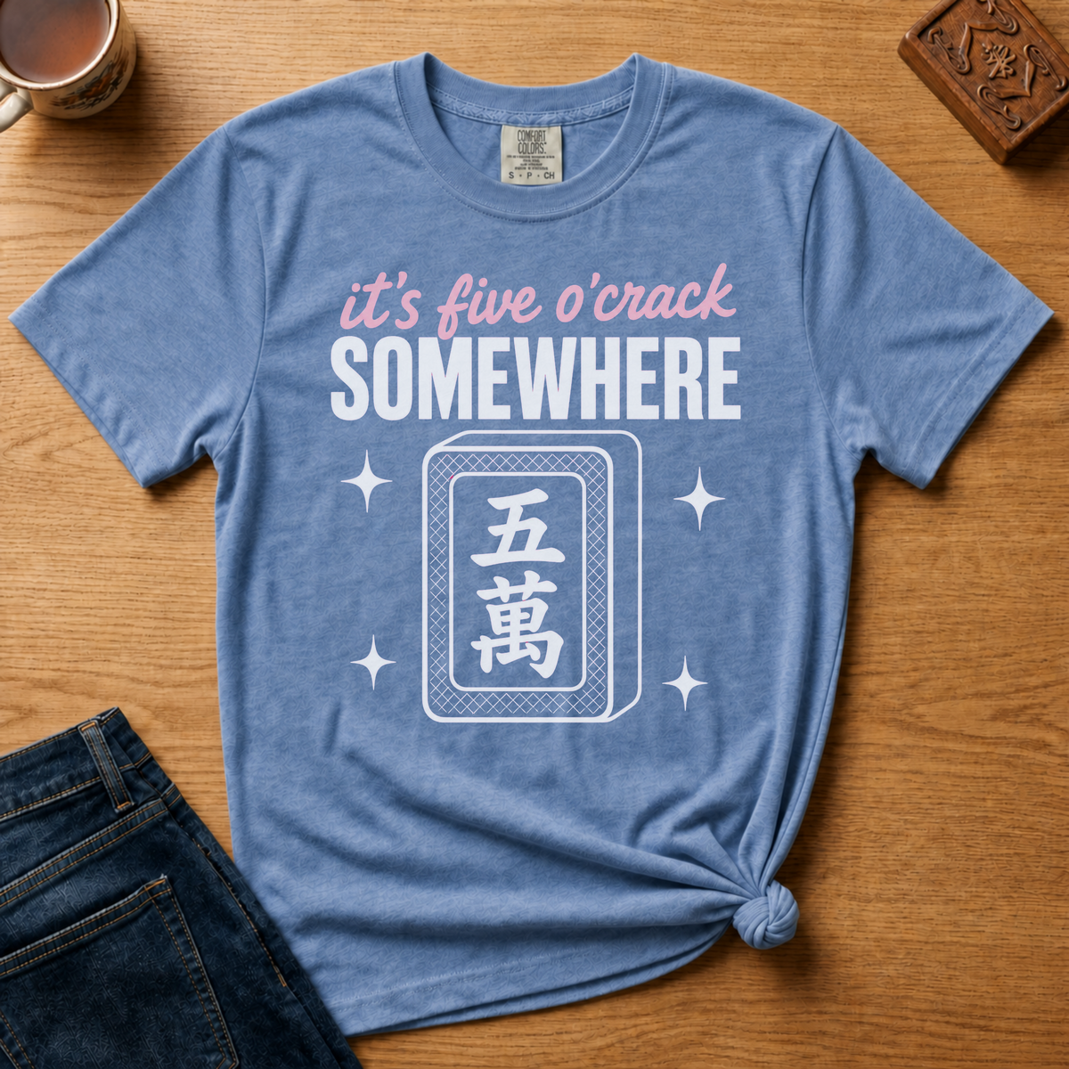 It's Five O'Crack Somewhere Shirt in Violet - pink and white five o'crack lettering with a five-crack tile on a purple Comfort Colors 1717 tee, flat lay