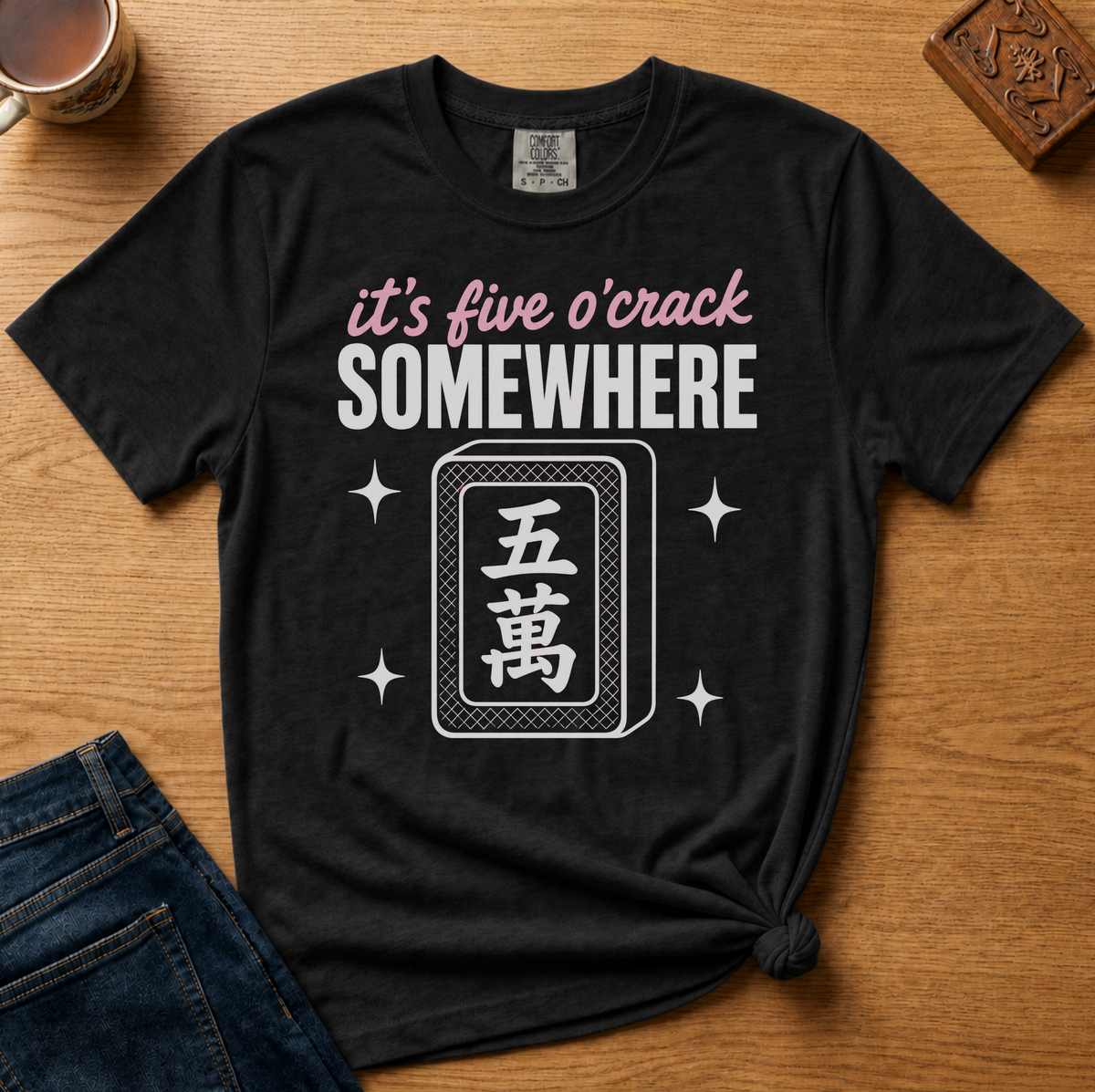 It's Five O'Crack Somewhere Shirt in Espresso - pink and white five o'crack lettering with a five-crack tile on a brown Comfort Colors 1717 tee, flat lay