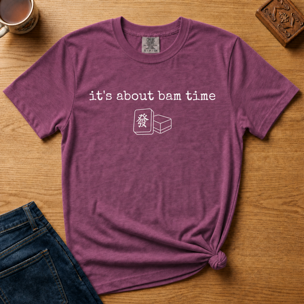 It's About Bam Time Shirt in Black - white typewriter text with a green dragon tile pair on a black Comfort Colors 1717 tee, flat lay