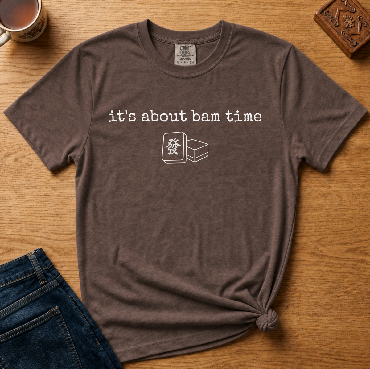 It's About Bam Time Shirt in Moss - white typewriter text with a green dragon tile pair on a green Comfort Colors 1717 tee, flat lay