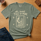 Oh Sweet Tile Of Mine Shirt in Jean Blue - cream oh sweet tile of mine lettering with a crowned peacock tile on a slate blue Comfort Colors 1717 tee, flat lay