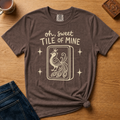 Oh Sweet Tile Of Mine Shirt in Berry - cream oh sweet tile of mine lettering with a crowned peacock tile on a berry Comfort Colors 1717 tee, flat lay