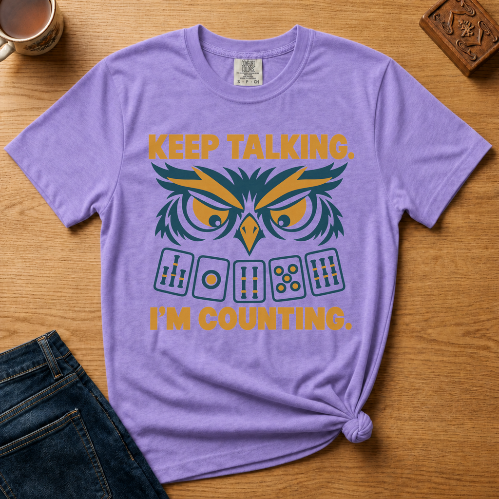 Close-up of the Keep Talking, I'm Counting owl design on a Blossom Comfort Colors t-shirt.