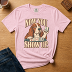 Close-up of the Now You Show Up basset hound design on a Blossom Comfort Colors t-shirt.