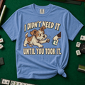 I Didn't Need It Until You Took It T-Shirt in Blue Jean - knotted tee on a green mahjong mat with scattered tiles, printed with a scruffy puppy lunging for a tile as another paw takes it away, and the words I Didn't Need It Until You Took It