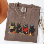 Four black cats hiking and camping on a Espresso Comfort Colors T-shirt