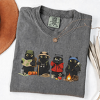 Four black cats hiking and camping on a Pepper Comfort Colors T-shirt