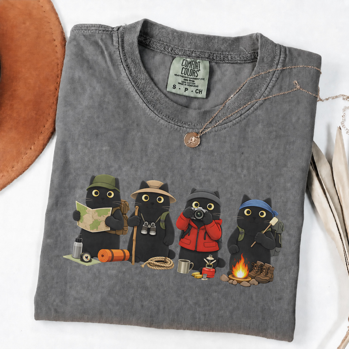 Four black cats hiking and camping on a Pepper Comfort Colors T-shirt