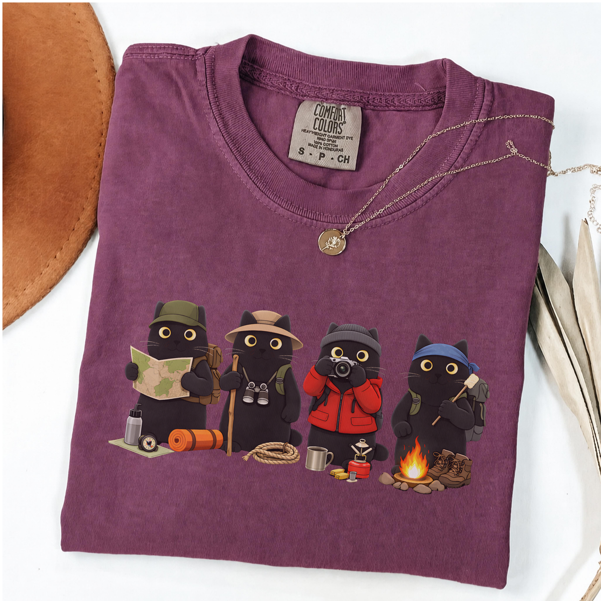 Four black cats hiking and camping on a Berry Comfort Colors T-shirt