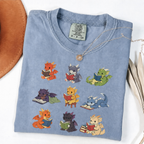 Nine colourful bookish dragons reading on an Blue Jean Comfort Colors T-shirt
