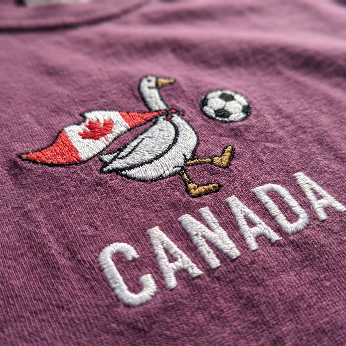 Embroidered Canada Soccer Goose Shirt – Berry embroidery close-up