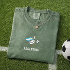 Embroidered Argentina Soccer Goose Shirt – Moss flat lay