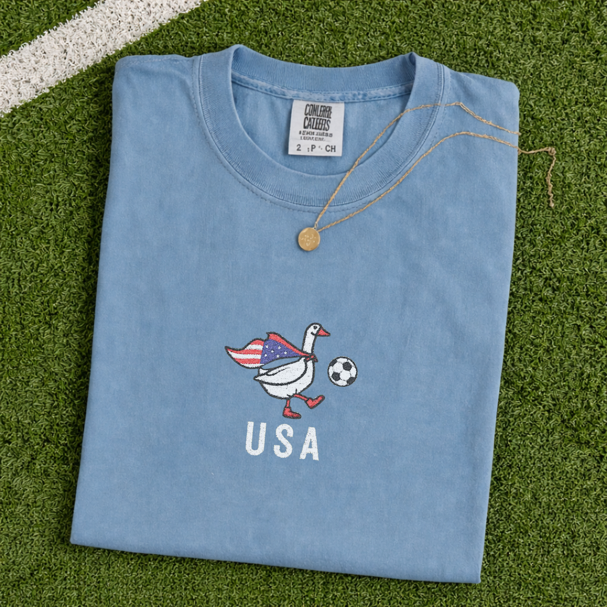 USA Soccer Goose embroidered shirt – Blue Jean on grass