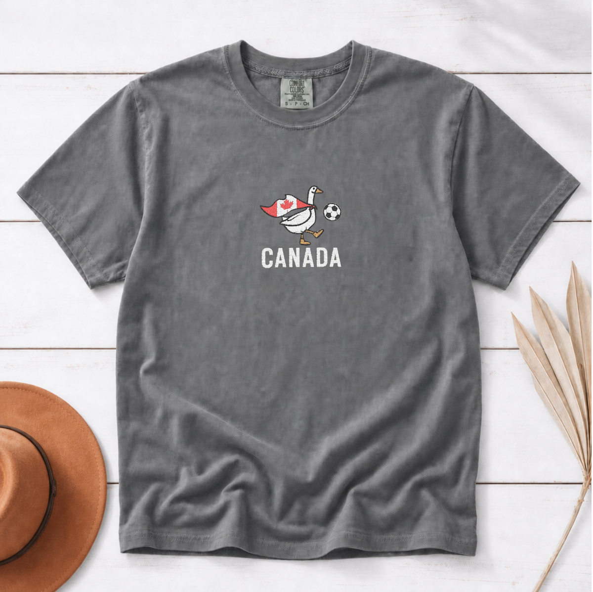 Embroidered Canada Soccer Goose Shirt – Pepper flat lay