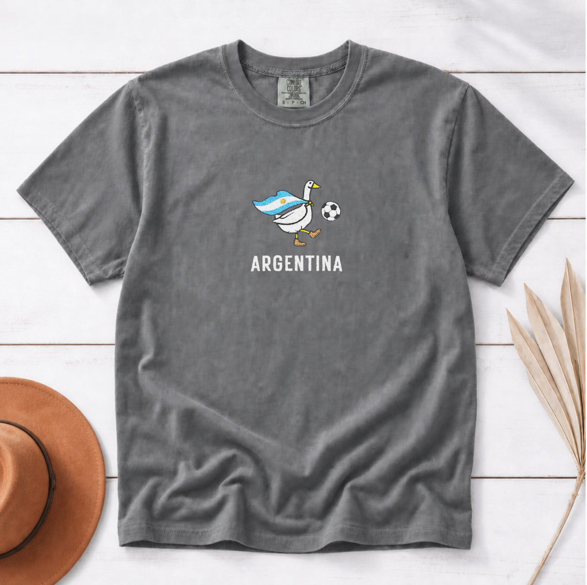 Embroidered Argentina Soccer Goose Shirt – Pepper flat lay